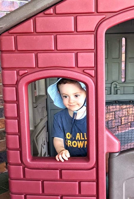 Playing in the cubby house.