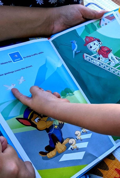 Reading a storybook.