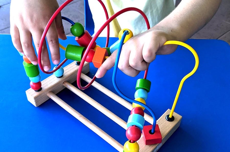 Playing with a bead maze.