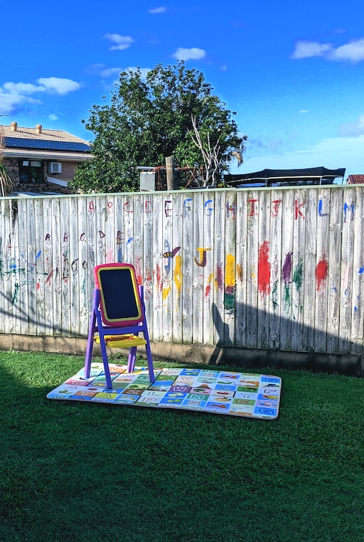 Our chalk board and painted fence in the garden.