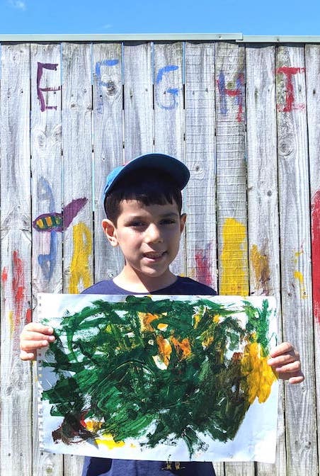 Showing off our paintings.